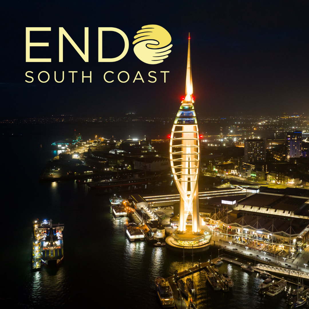 Spinnaker Tower lit in yellow with yellow endo south coast logo